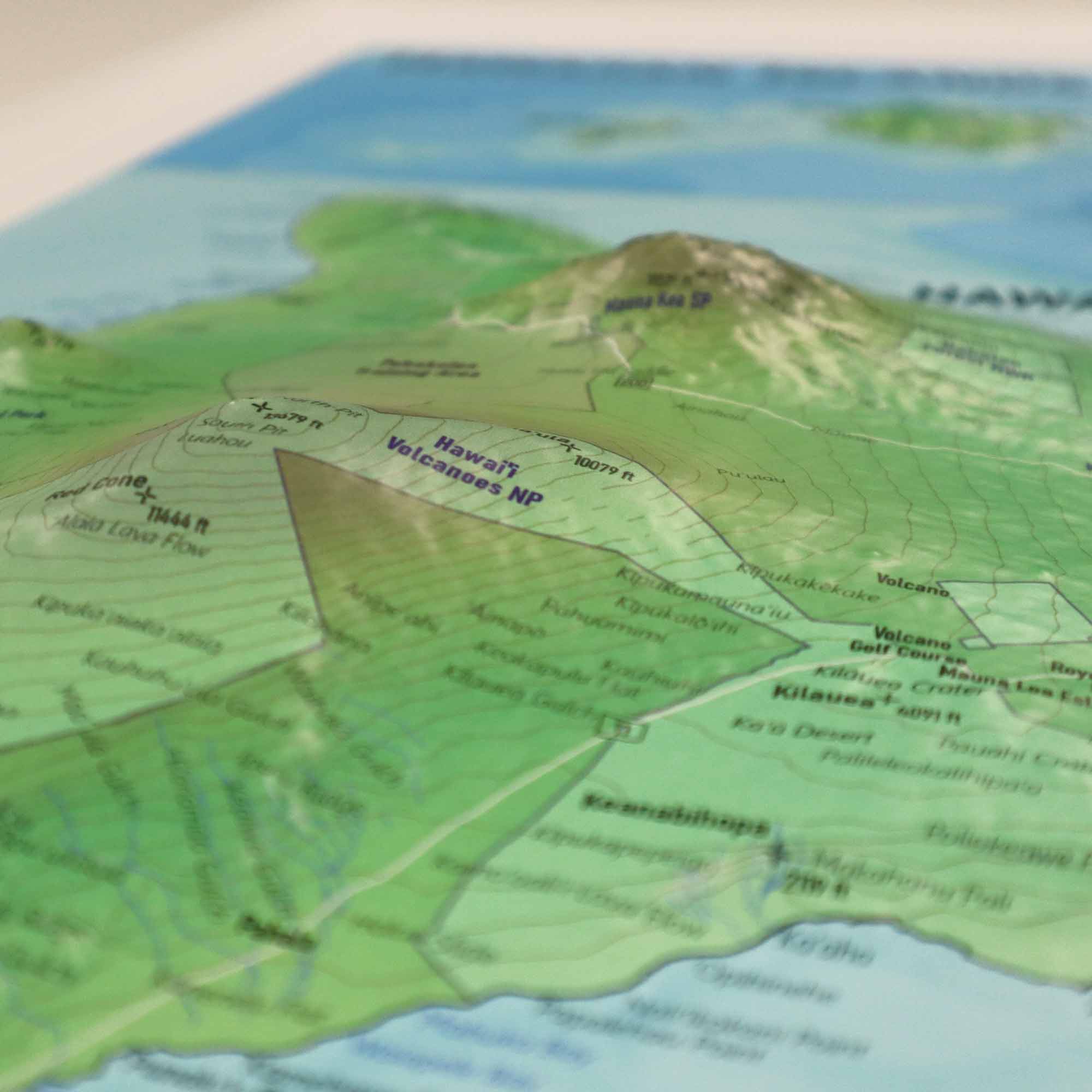 Hawaii Raised Relief 3D Map showcasing detailed topography with lush valleys, volcanic peaks, and rugged coastlines, perfect for educators, adventurers, and geography enthusiasts interested in Hawaii's natural beauty and cultural heritage.