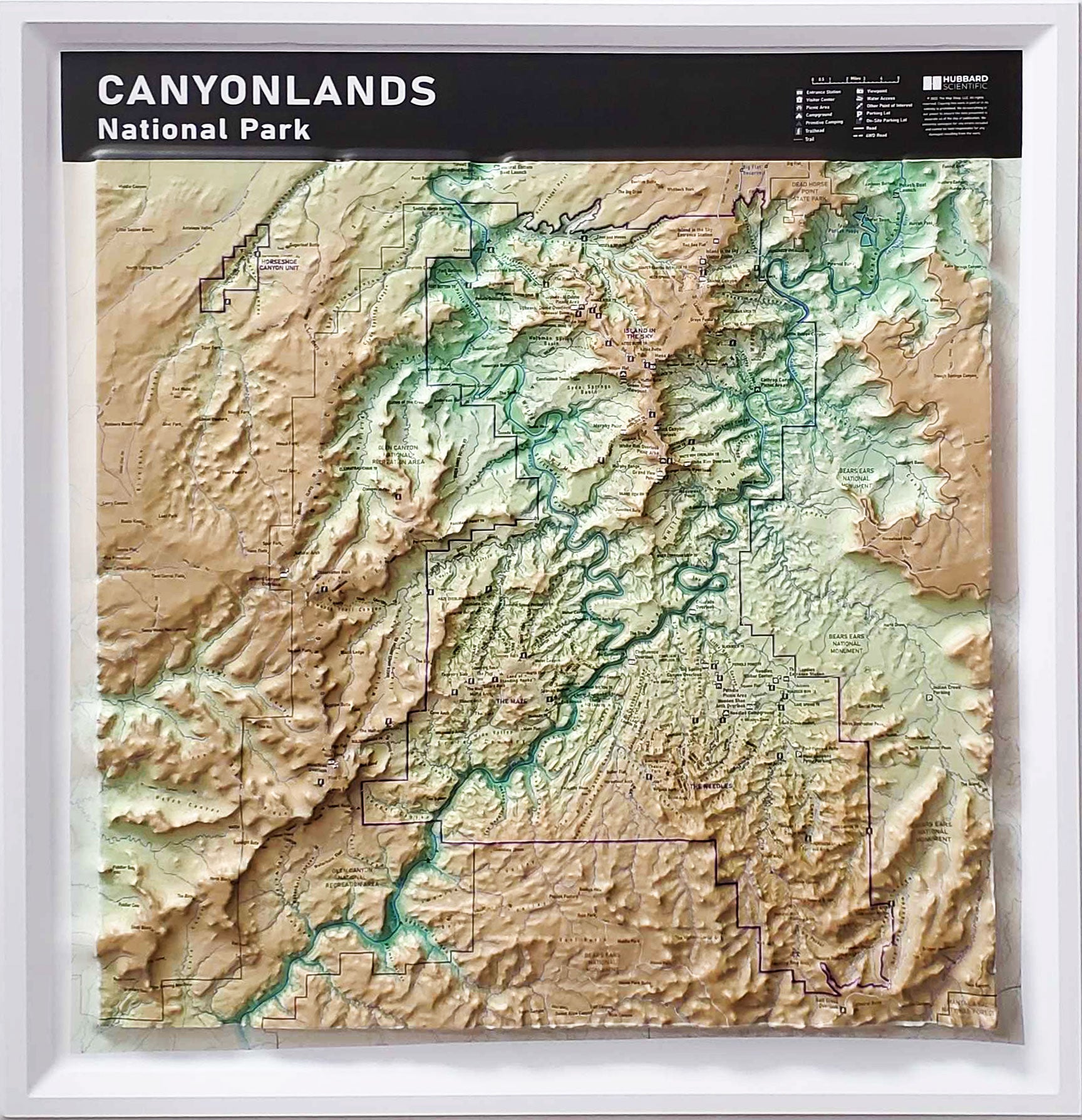 Three-dimensional (3D) raised relief map of Canyonlands National Park, Utah, showcasing The Needles, The Maze, and Mesa Arch in stunning detail. The map highlights canyons, mesas, buttes, and rivers that shape this dramatic landscape.